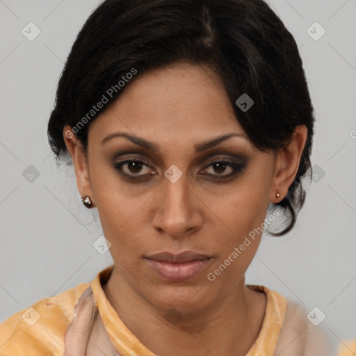 Joyful latino young-adult female with short  brown hair and brown eyes