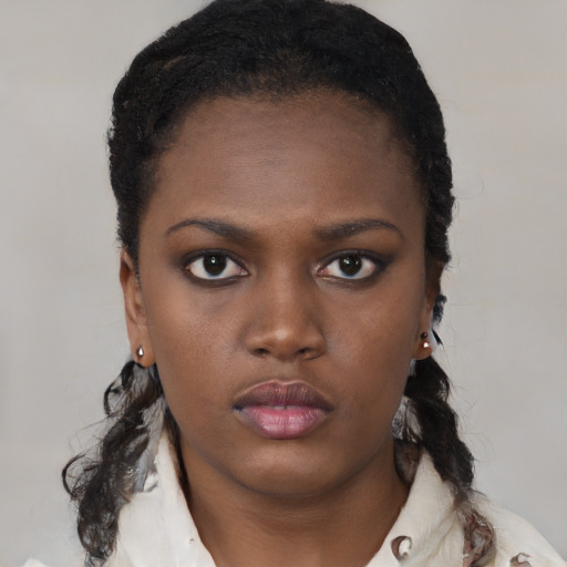 Neutral black young-adult female with short  black hair and brown eyes