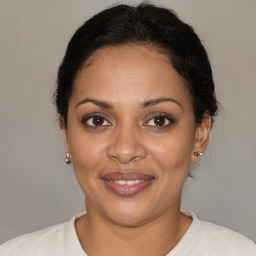 Joyful black adult female with short  brown hair and brown eyes