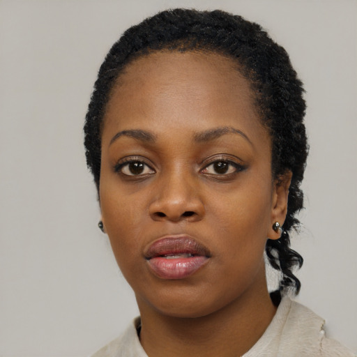 Neutral black young-adult female with short  black hair and brown eyes