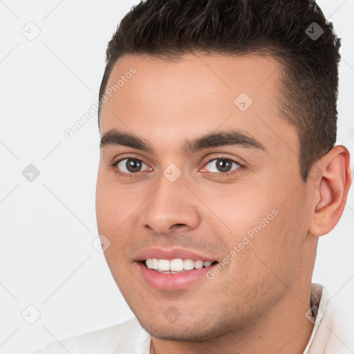 Joyful white young-adult male with short  brown hair and brown eyes