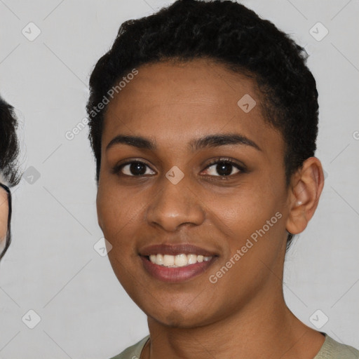 Joyful black young-adult female with short  black hair and brown eyes