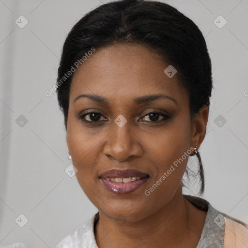 Joyful black young-adult female with short  black hair and brown eyes