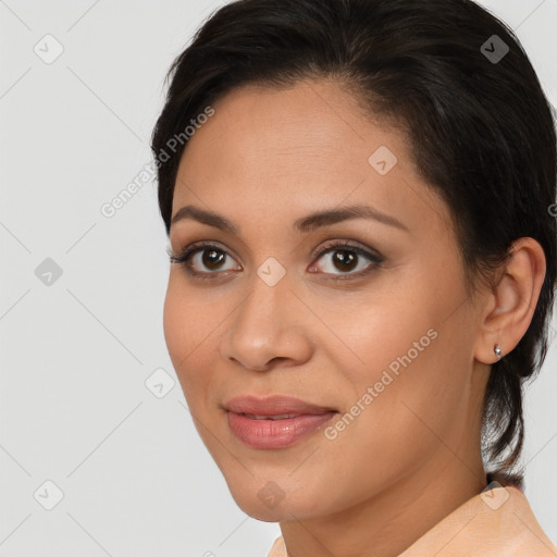 Joyful latino young-adult female with long  brown hair and brown eyes