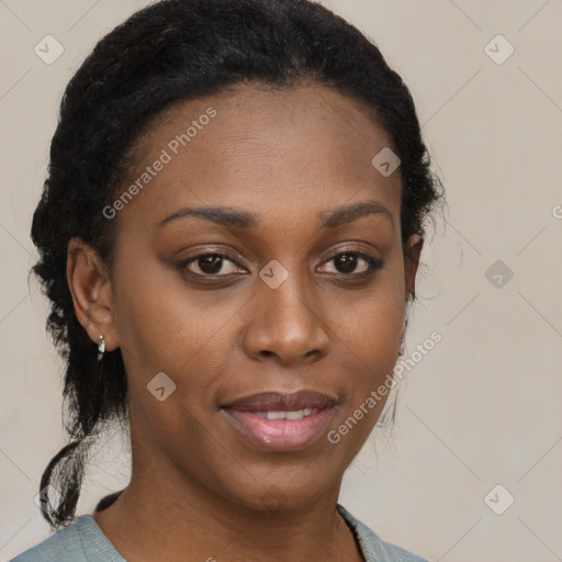 Joyful black young-adult female with long  brown hair and brown eyes