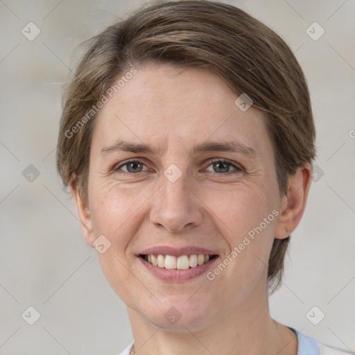 Joyful white adult female with medium  brown hair and grey eyes