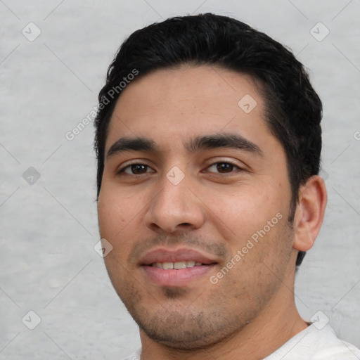 Joyful white young-adult male with short  black hair and brown eyes