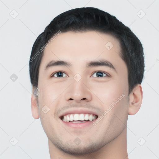 Joyful white young-adult male with short  black hair and brown eyes