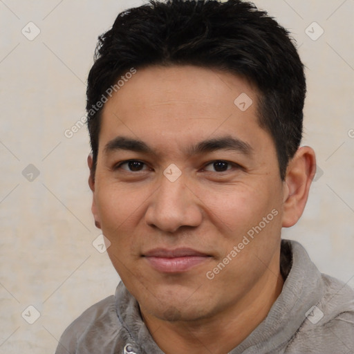 Joyful asian young-adult male with short  black hair and brown eyes