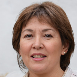 Joyful white adult female with medium  brown hair and brown eyes