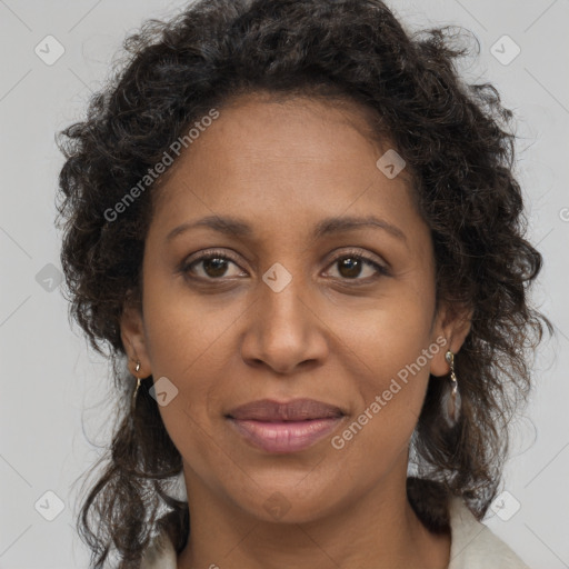 Joyful black adult female with medium  brown hair and brown eyes