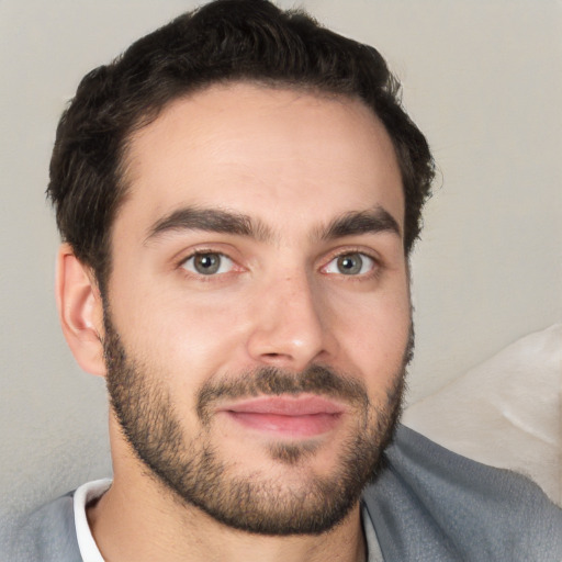 Joyful white young-adult male with short  black hair and brown eyes