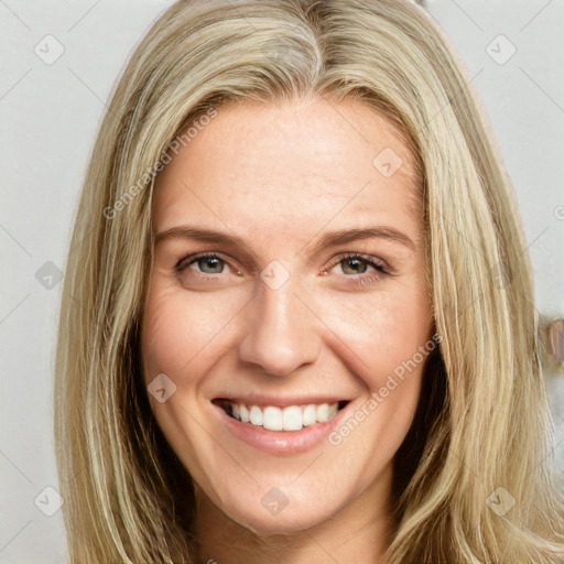 Joyful white young-adult female with long  brown hair and blue eyes