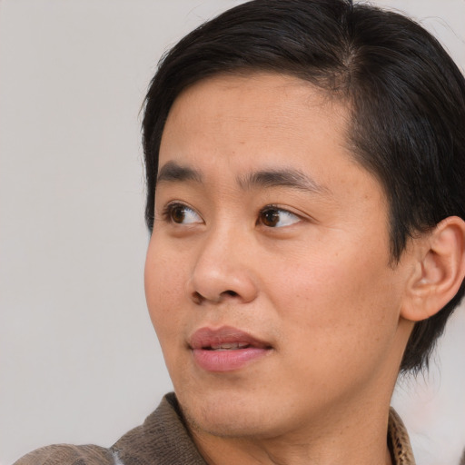 Neutral asian young-adult male with short  brown hair and brown eyes