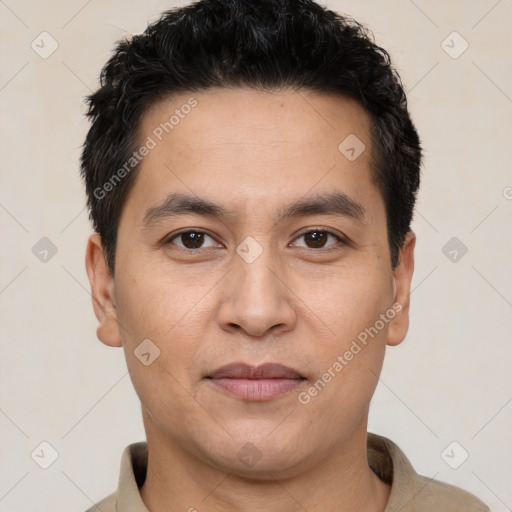 Joyful white young-adult male with short  black hair and brown eyes