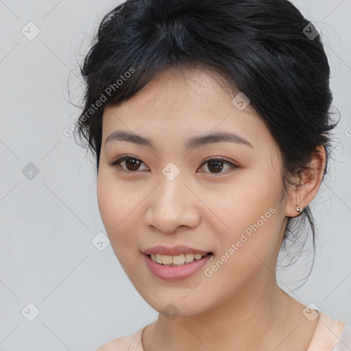 Joyful asian young-adult female with medium  black hair and brown eyes