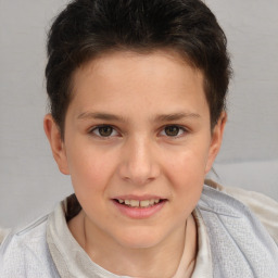 Joyful white child female with short  brown hair and brown eyes