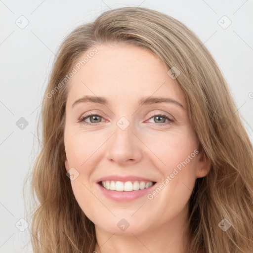 Joyful white young-adult female with long  brown hair and blue eyes