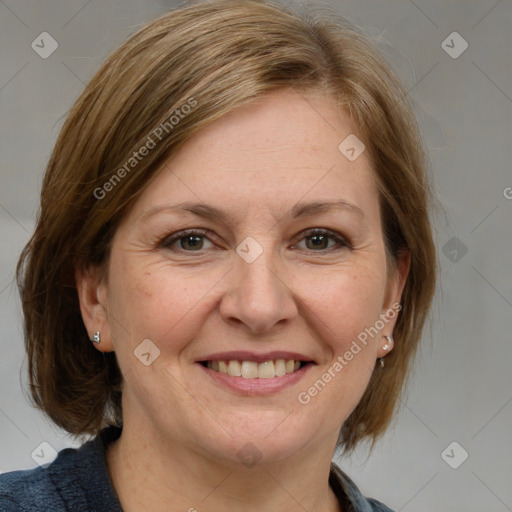 Joyful white adult female with medium  brown hair and blue eyes