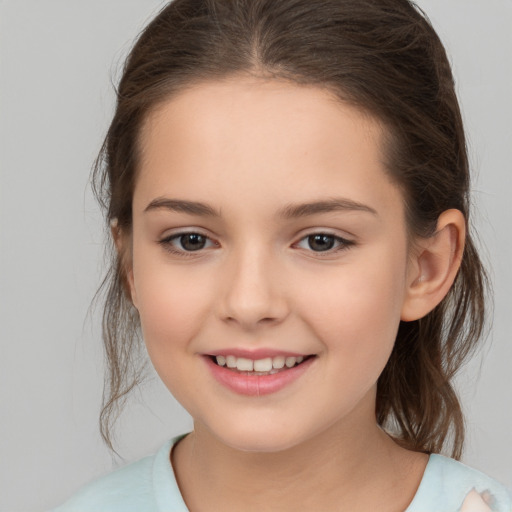 Joyful white child female with medium  brown hair and brown eyes