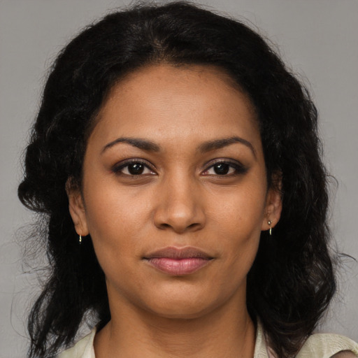 Joyful black young-adult female with medium  black hair and brown eyes