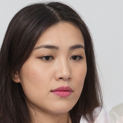Neutral asian young-adult female with long  brown hair and brown eyes