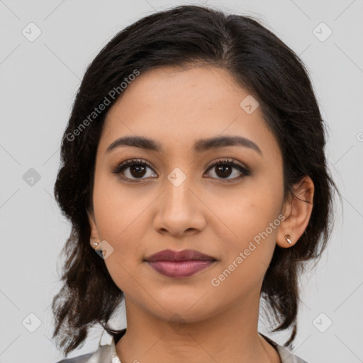 Joyful latino young-adult female with medium  brown hair and brown eyes