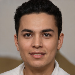 Joyful white young-adult male with short  black hair and brown eyes