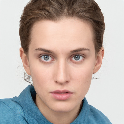 Neutral white young-adult female with medium  brown hair and grey eyes