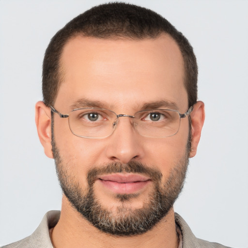 Joyful white adult male with short  brown hair and brown eyes