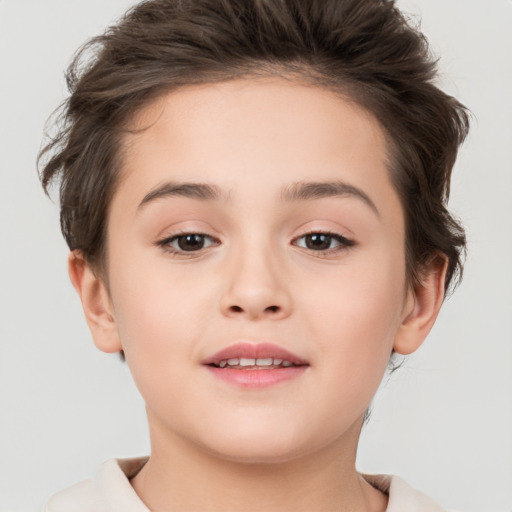 Joyful white child female with short  brown hair and brown eyes