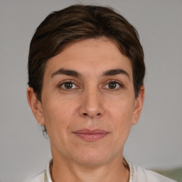 Joyful white adult female with short  brown hair and grey eyes