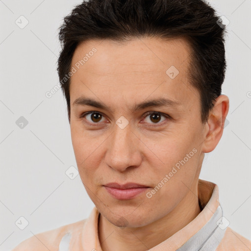 Joyful white adult male with short  brown hair and brown eyes