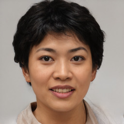 Joyful asian young-adult female with short  brown hair and brown eyes