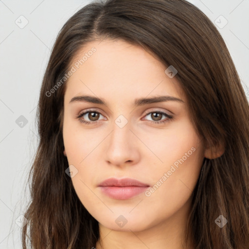 Neutral white young-adult female with long  brown hair and brown eyes