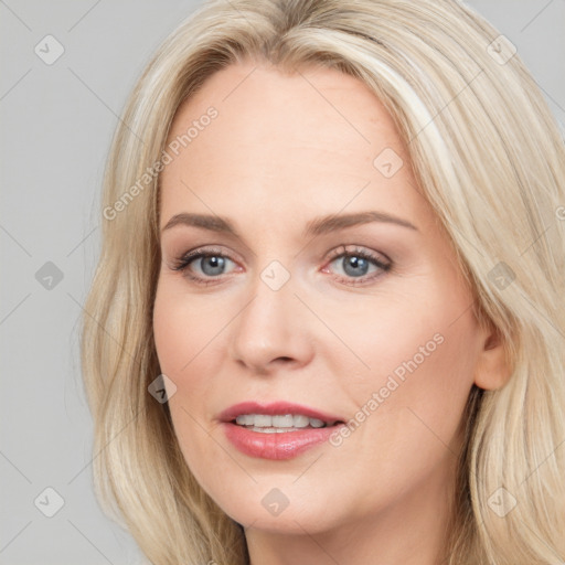 Joyful white young-adult female with long  brown hair and blue eyes