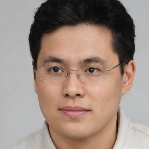 Neutral asian adult male with short  black hair and brown eyes