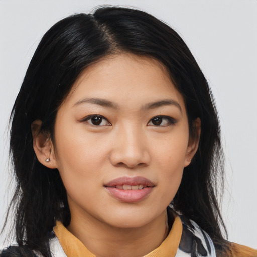 Joyful asian young-adult female with medium  black hair and brown eyes