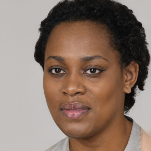 Neutral black young-adult female with short  black hair and brown eyes