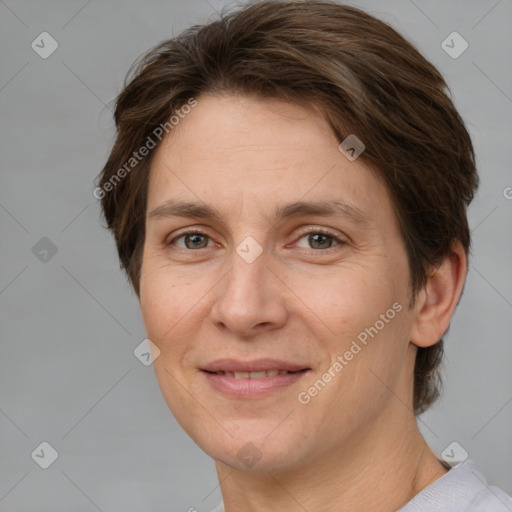 Joyful white adult female with short  brown hair and grey eyes