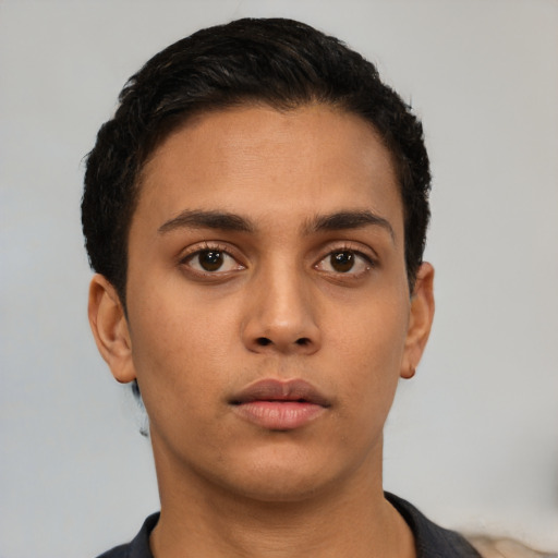 Neutral latino young-adult male with short  black hair and brown eyes