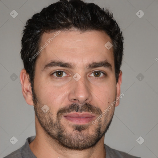 Joyful white adult male with short  black hair and brown eyes