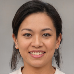 Joyful asian young-adult female with medium  brown hair and brown eyes