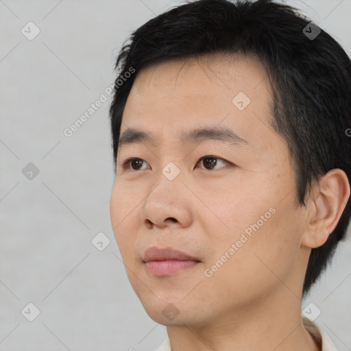 Neutral asian young-adult male with short  black hair and brown eyes