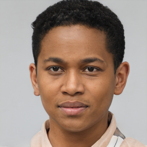 Joyful latino young-adult male with short  brown hair and brown eyes