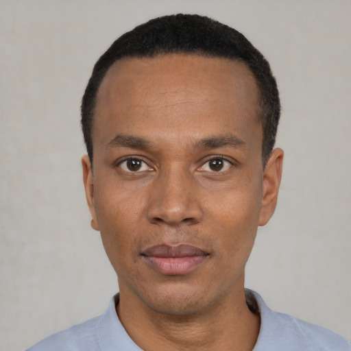 Neutral black young-adult male with short  black hair and brown eyes
