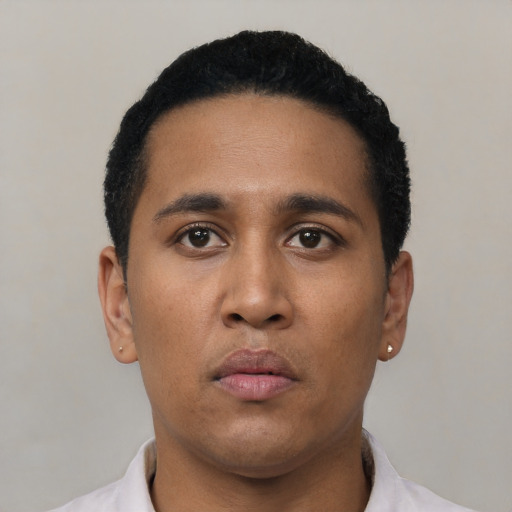Neutral latino young-adult male with short  black hair and brown eyes
