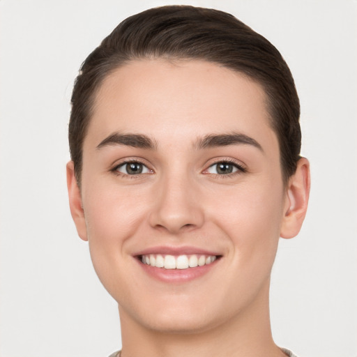 Joyful white young-adult female with short  brown hair and brown eyes