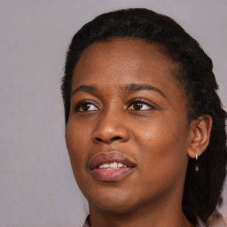 Joyful black young-adult female with medium  black hair and brown eyes