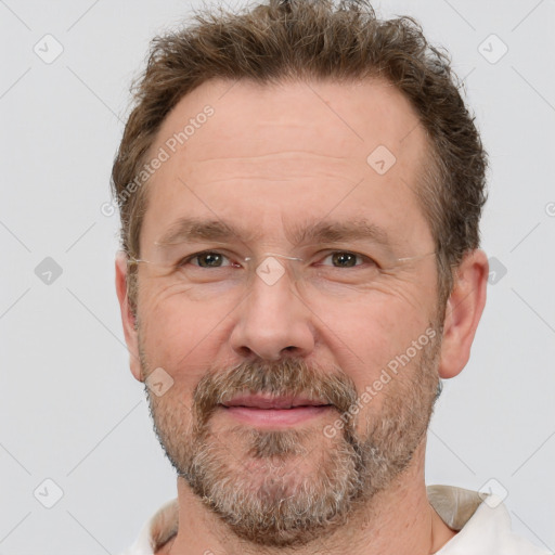 Joyful white adult male with short  brown hair and grey eyes